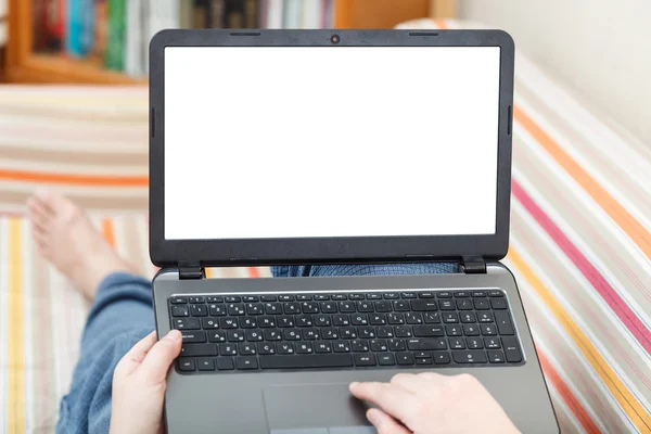 Man writes on laptop with cut out screen — Stock Photo, Image