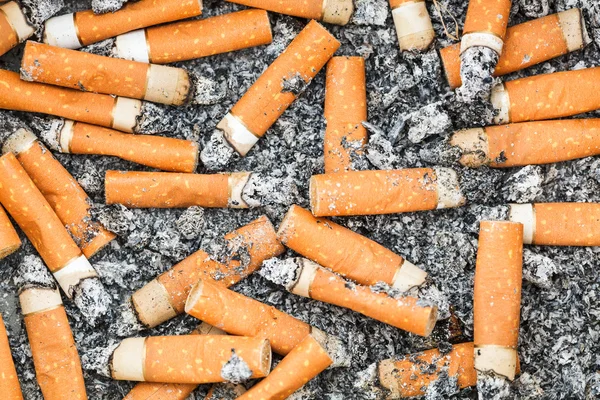 Background from cigarette butts and ash — Stock Photo, Image