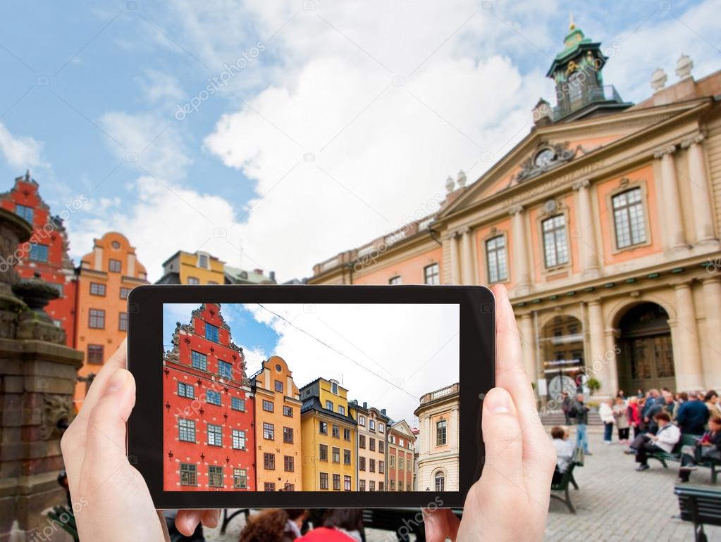 tourist taking photo Stortorget square Stockholm