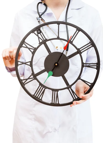 Nurse holds big clock — Stock Photo, Image