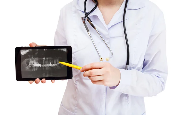 Nurse points on tablet pc with human jaws — Stock Photo, Image