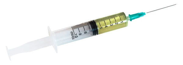 Little 10 ml syringe filled with yellow liquid — Stock Photo, Image