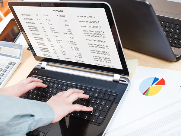 Businessman runs with laptop at office desk — Stock Photo, Image