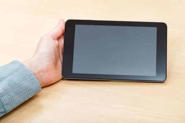 Businessman hand with tablet PC with black screen — Stock Photo, Image