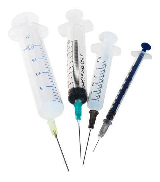 Quatro novas seringas descartáveis de plástico médico — Fotografia de Stock