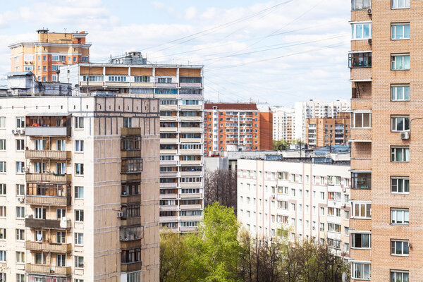 city many-storied houses in spring day