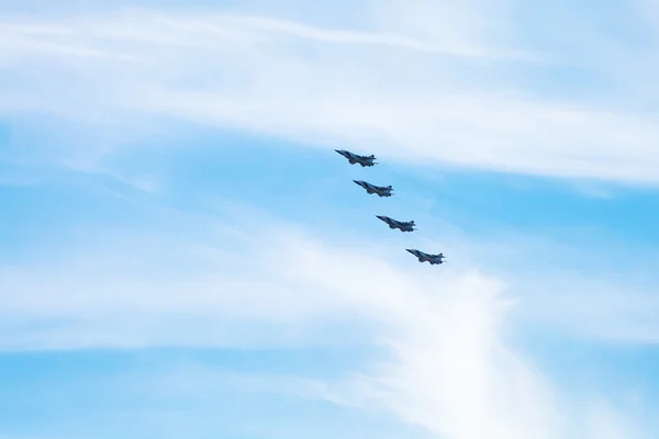 Four military fighter aircrafts in cloudy sky — Stock Photo, Image