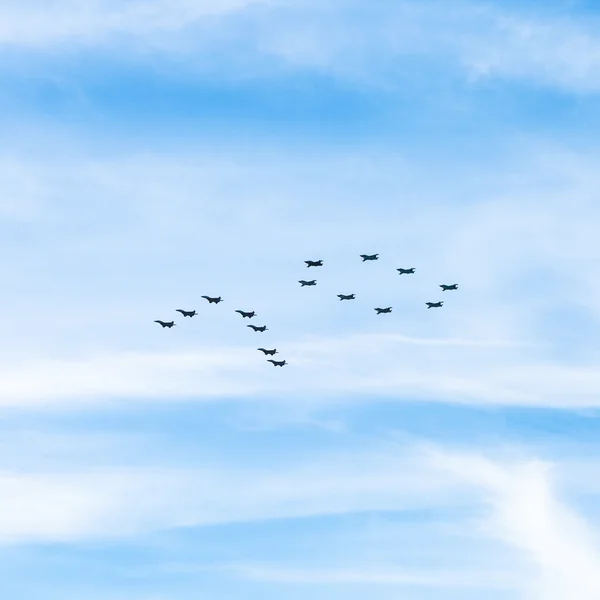Military fighters and attack planes in sky — Stock Photo, Image