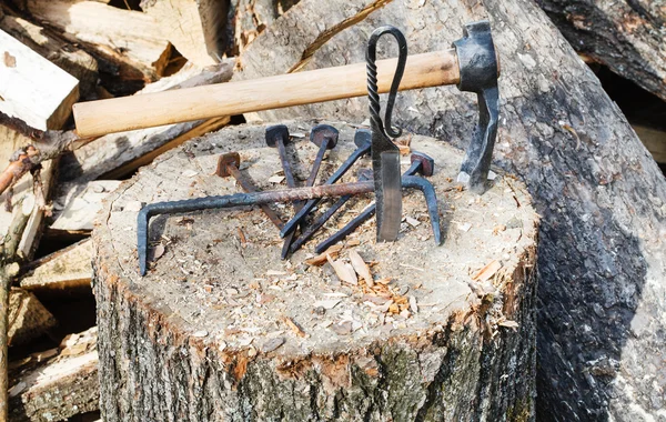 Hew ax and forged hardware on wooden deck — Stock Photo, Image