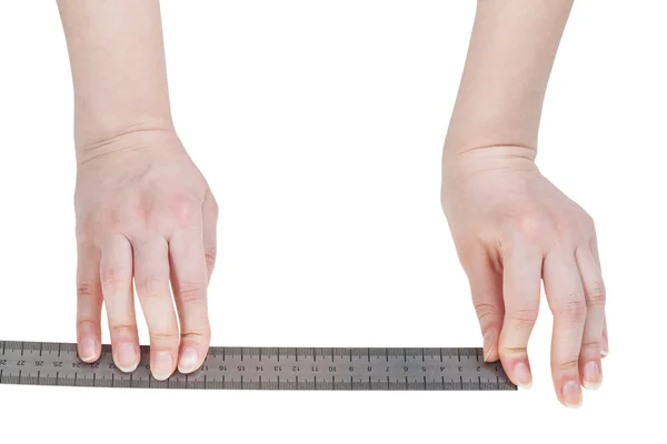 Female hands with metallic ruler isolated — Stock Photo, Image