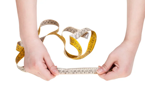 Female hands with measuring tape line isolated — Stock Photo, Image