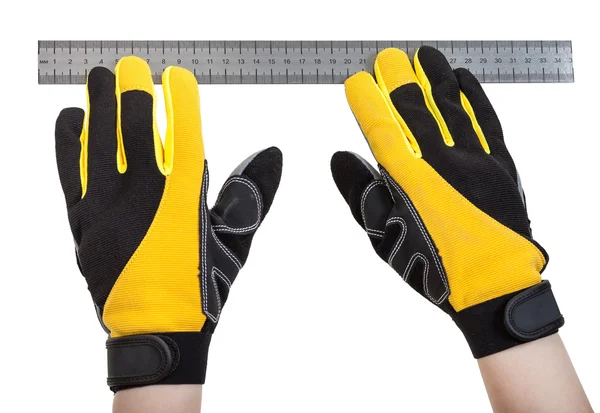Costruttore mani in guanti di sicurezza con righello — Foto Stock
