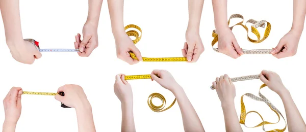 Conjunto de mãos femininas com fitas de medição — Fotografia de Stock