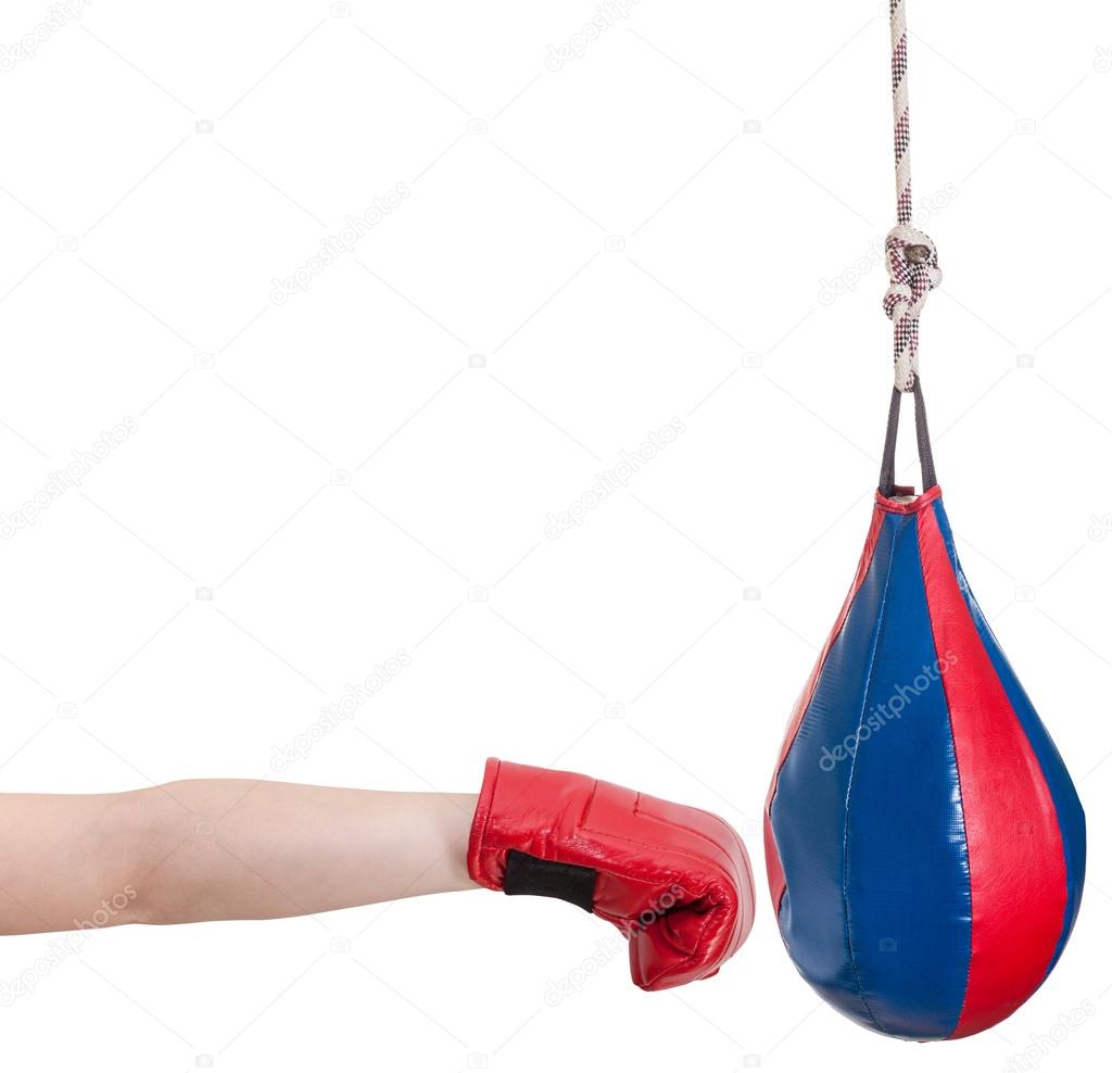 kid with boxing glove punches punching bag