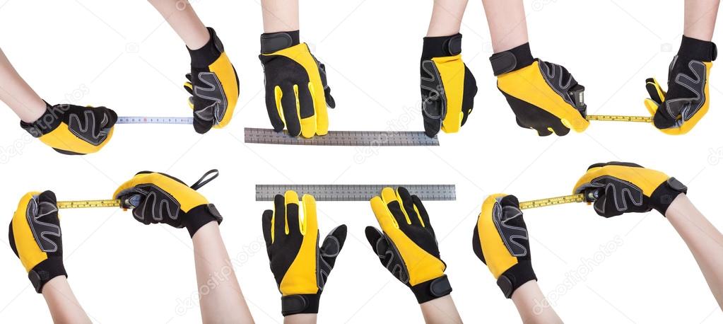 Worker hands in safety gloves with measuring tools