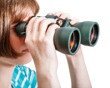 girl watching through field glasses isolated