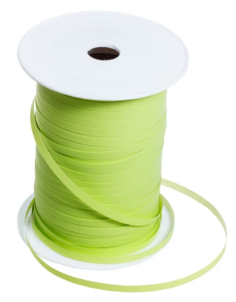 Plastic bobbin with green packing tape isolated — Stock Photo, Image