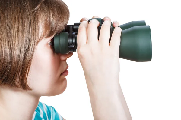 Side view of girl looks through binoculars — 图库照片