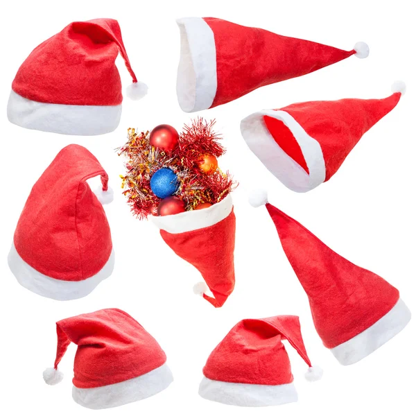 Uppsättning typiska röda jultomten hatt isolerade — Stockfoto