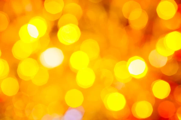 Yellow and red blurred shimmering Christmas lights — Stock Photo, Image