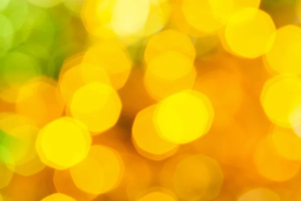 Blurred yellow green big Christmas lights — Stock Photo, Image