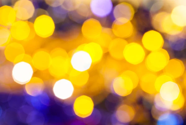 Amarillo oscuro y violeta parpadeando luces de Navidad — Foto de Stock