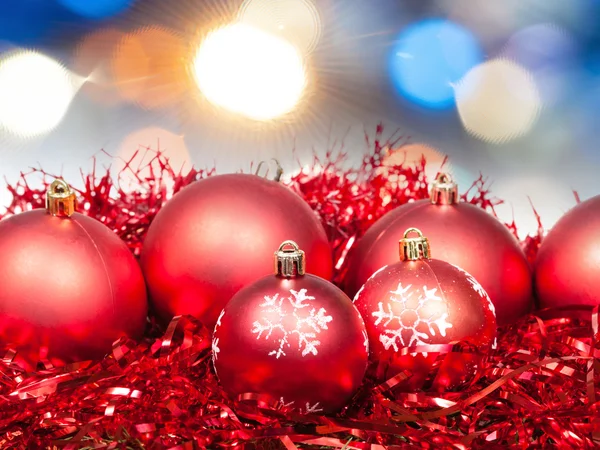 Xmas red balls on blurred diffuse blue background — Stock Photo, Image