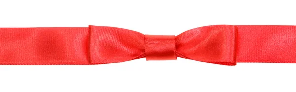 Real red bow knot on wide silk ribbon isolated — Stock Photo, Image