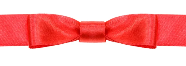 Symmetrische rode boog knoop op brede satijnen lint — Stockfoto