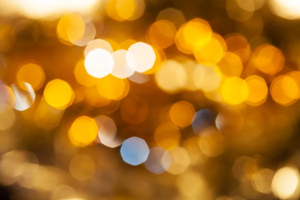 Yellow brown blurred shimmering Christmas lights — Stock Photo, Image