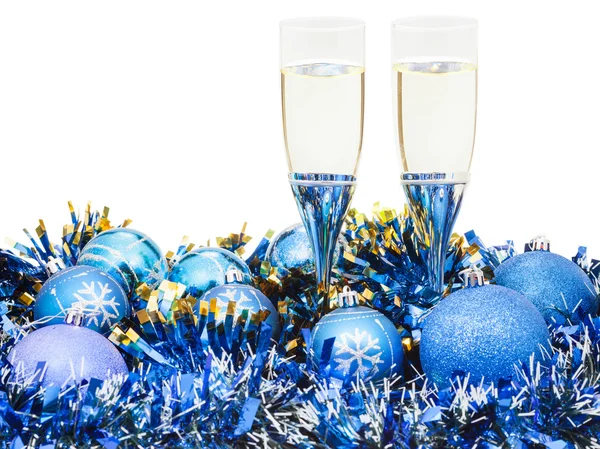 Glasses of wine and blue Xmas balls and tinsel — Stock Photo, Image