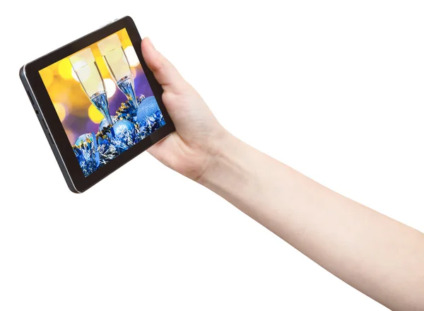Hand holds tablet pc with Xmas still life — Stockfoto