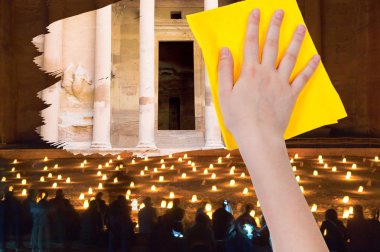 hand deletes night view of Petra by yellow rag clipart