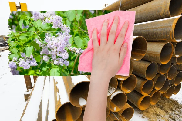Hand tar bort industriellt landskap av rosa tyg — Stockfoto