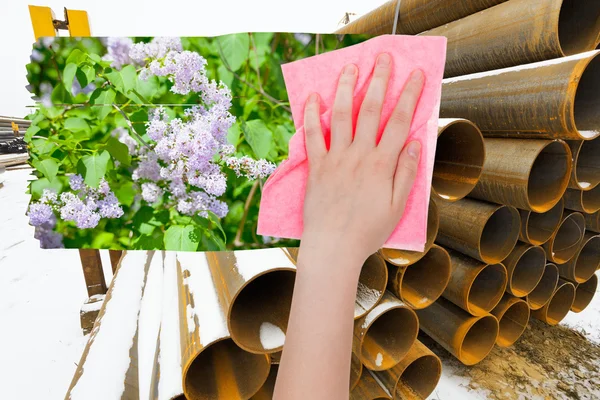 Hand löscht Industrielandschaft mit rosa Tuch — Stockfoto