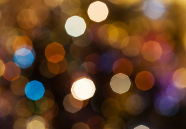 Donkerbruin wazig glinsterende lichten van Kerstmis — Stockfoto