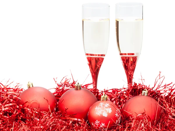 Two glasses of wine at red Christmas decorations — Stock fotografie