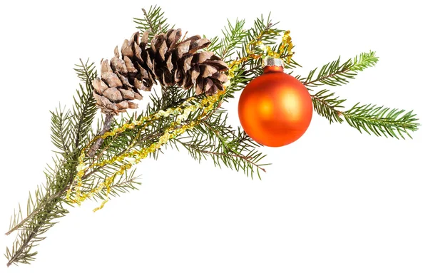 Branch of spruce tree with cone and orange ball — Stockfoto