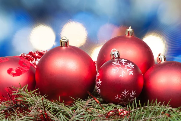 Xmas red balls on blurred blue background — Stock Photo, Image