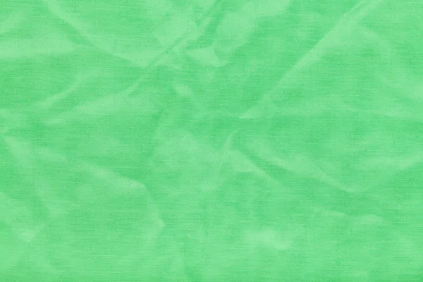 Bakgrund från ljus grön batiste tyg — Stockfoto