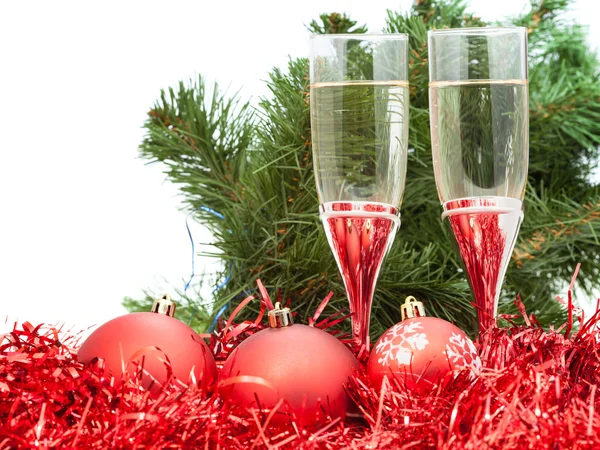 Glasses of wine and tree and red Christmas balls — Stock Photo, Image