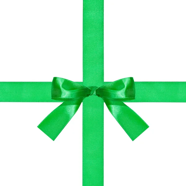 Großer grüner Schleifenknoten auf zwei sich kreuzenden Seidenbändern — Stockfoto