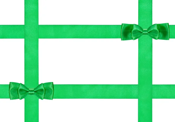 Two little double green bow knots on four ribbons — Stock Photo, Image
