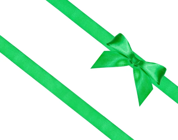 Big green bow knot on two diagonal silk ribbons — Stock Photo, Image