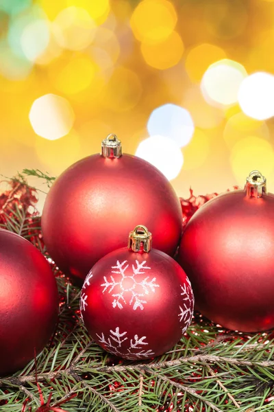 Xmas red balls and tree on yellow background — Stock Photo, Image