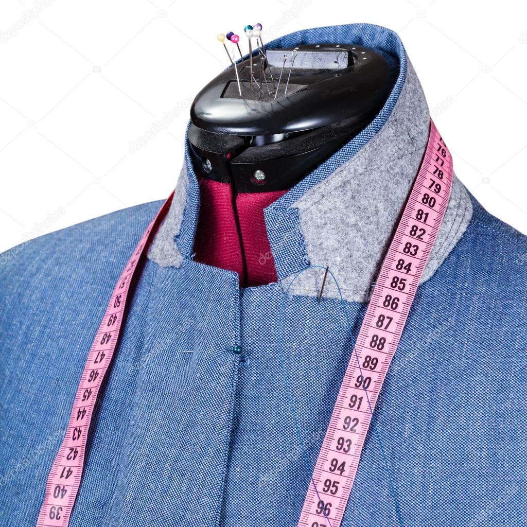 tailoring of man blue jacket on dummy isolated