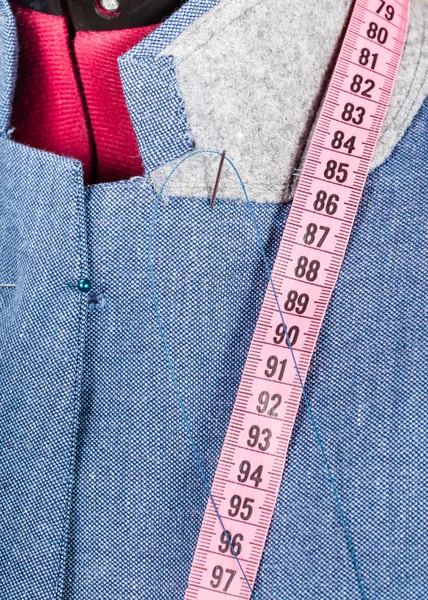 Tailoring of collar for blue jacket on dummy — Stock Photo, Image