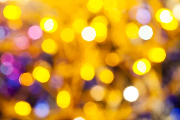 Yellow pink blurred shimmering Christmas lights — Stock Photo, Image