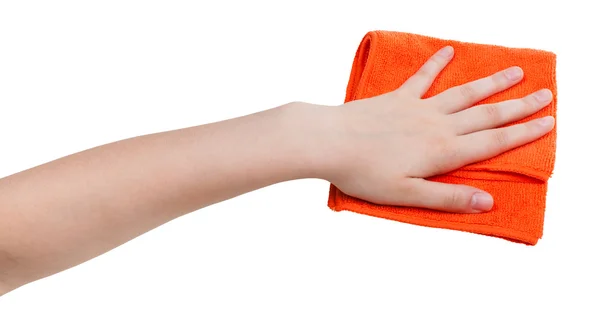 Hand mit orangefarbenem Staubtuch isoliert auf weißem Grund — Stockfoto