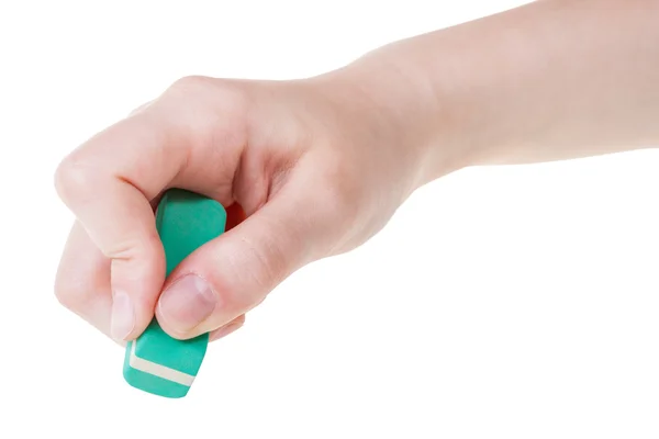 Hand with green new rubber eraser close up — Stock Photo, Image